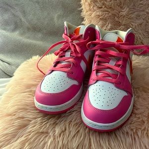 Nike pink and orange Jordan’s